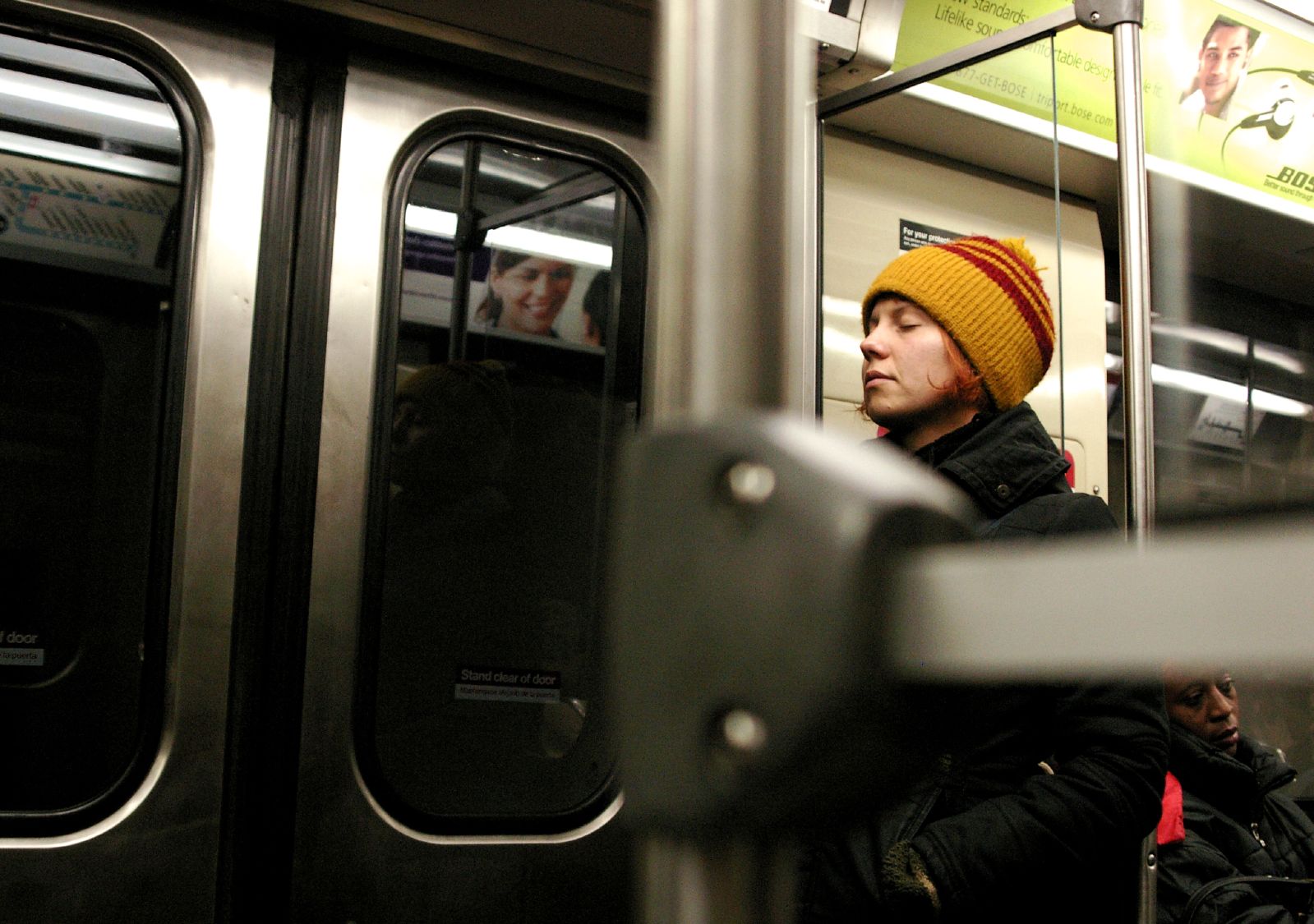 a person on a subway and looking out the window