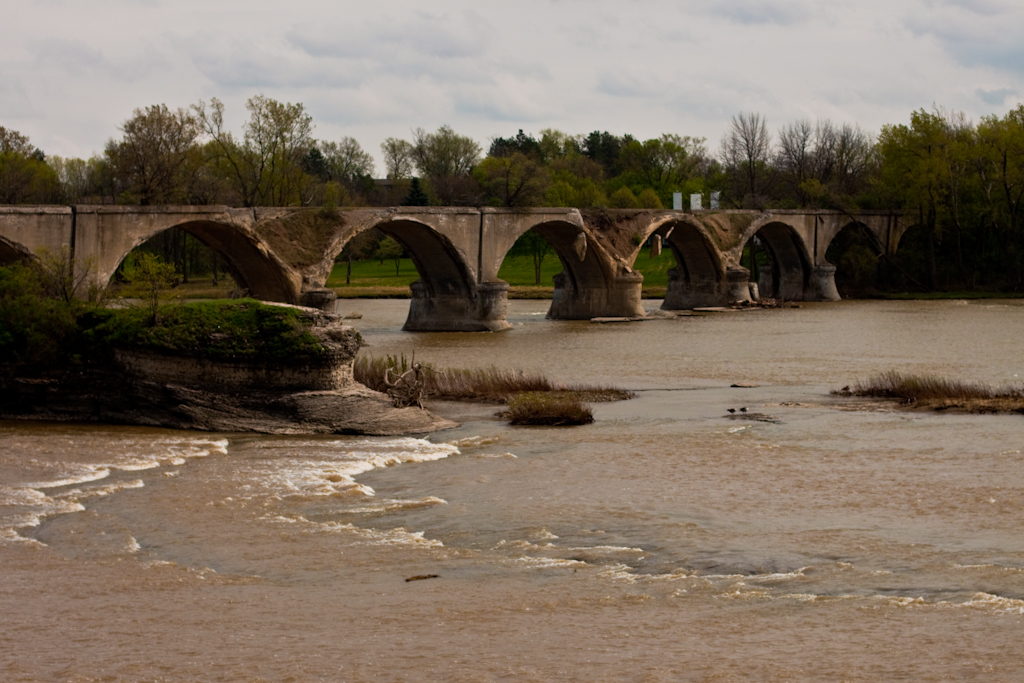 the stone bridge is built in the middle of the river