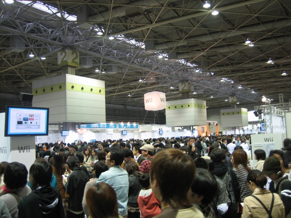 people are waiting at an indoor event for the show