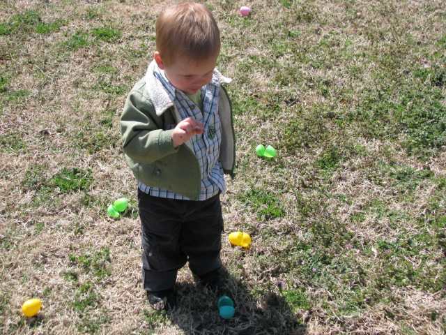 a  is in the middle of playing with eggs