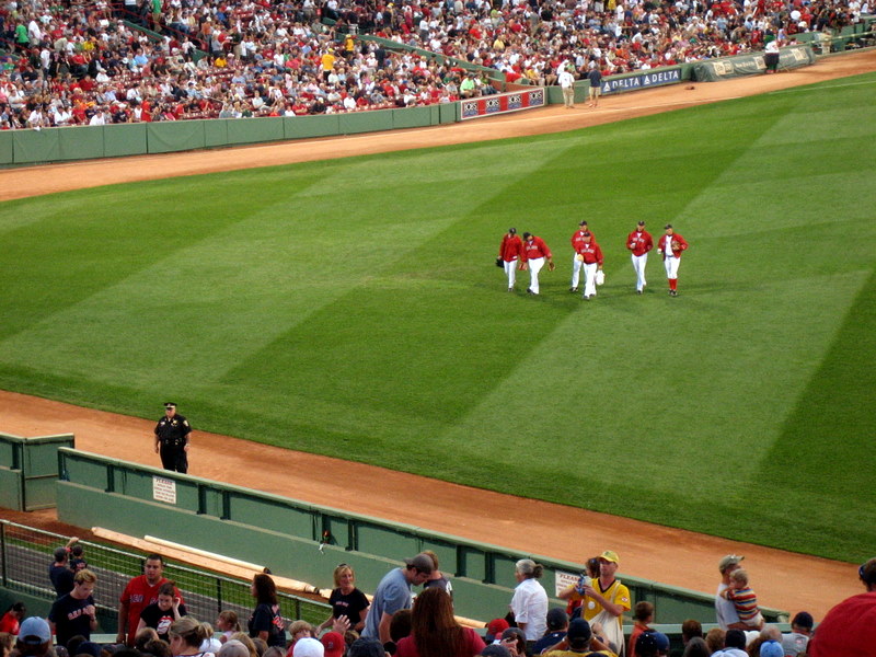 baseball players are lined up at the stands