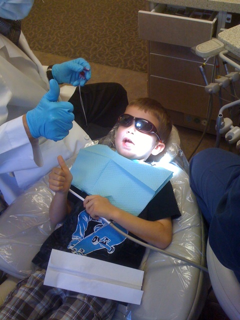 two s in the dentist with tools and gloves
