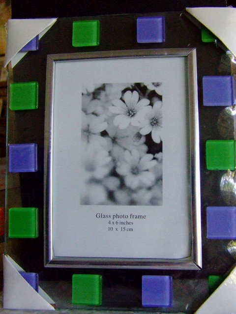 a picture frame with green and purple squares around it