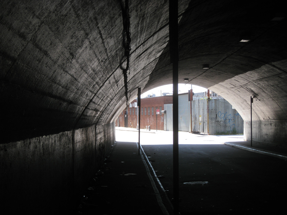 a tunnel with no walls and a wall near by