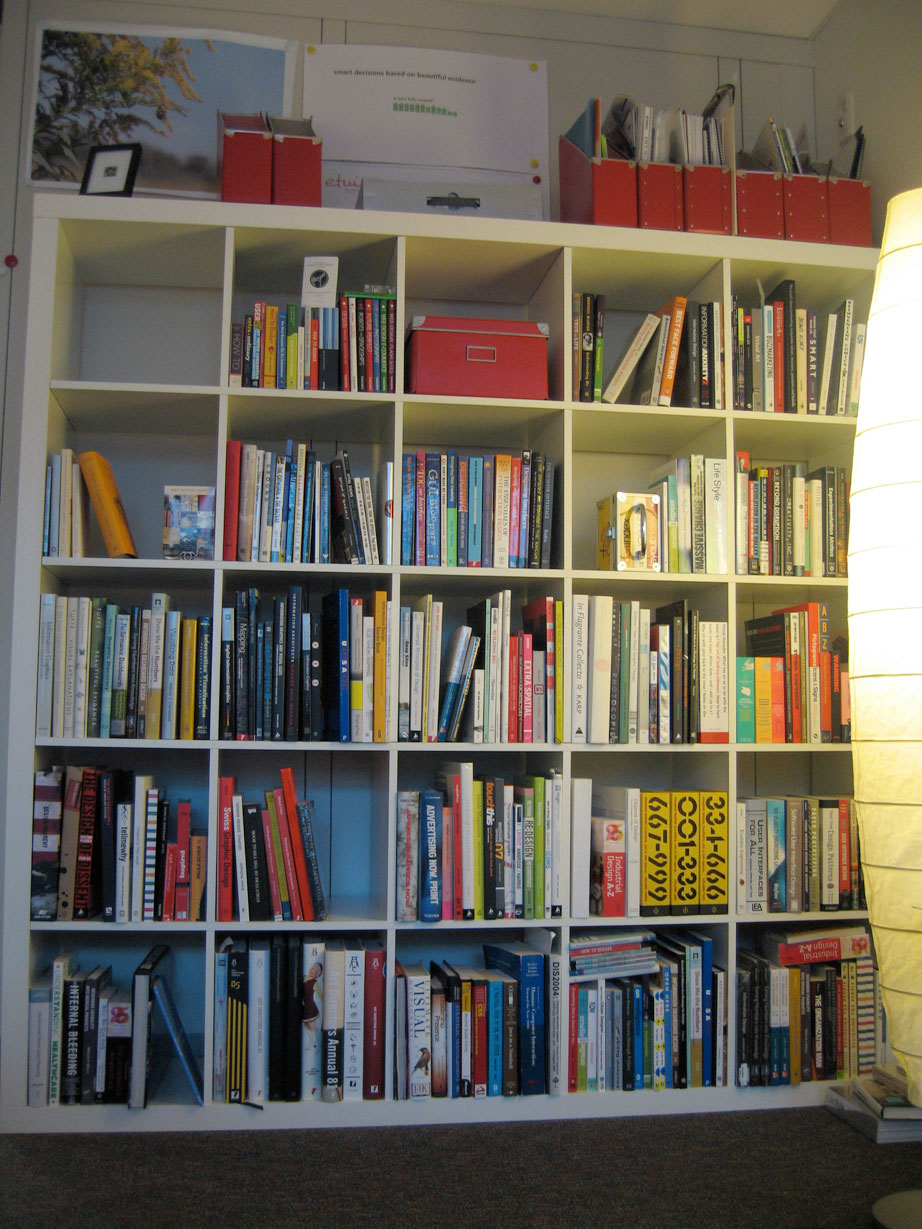 a shelf filled with books in a home
