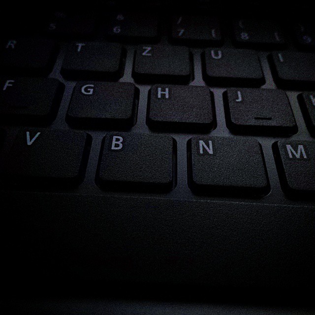 an up close view of a keyboard in the dark