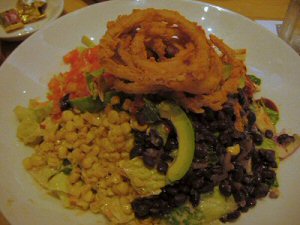 a plate of mexican food sitting on top of a table