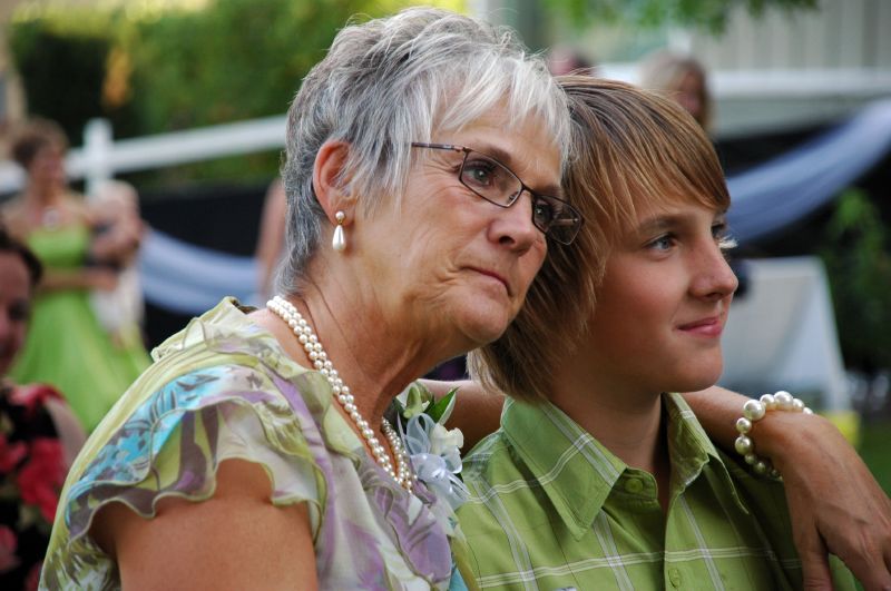 two woman are dressed up looking at soing