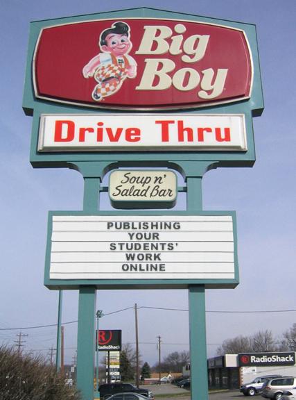 sign for big boy drive thru with car in background