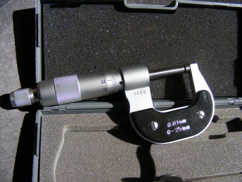 a microphone laying in an open hard case