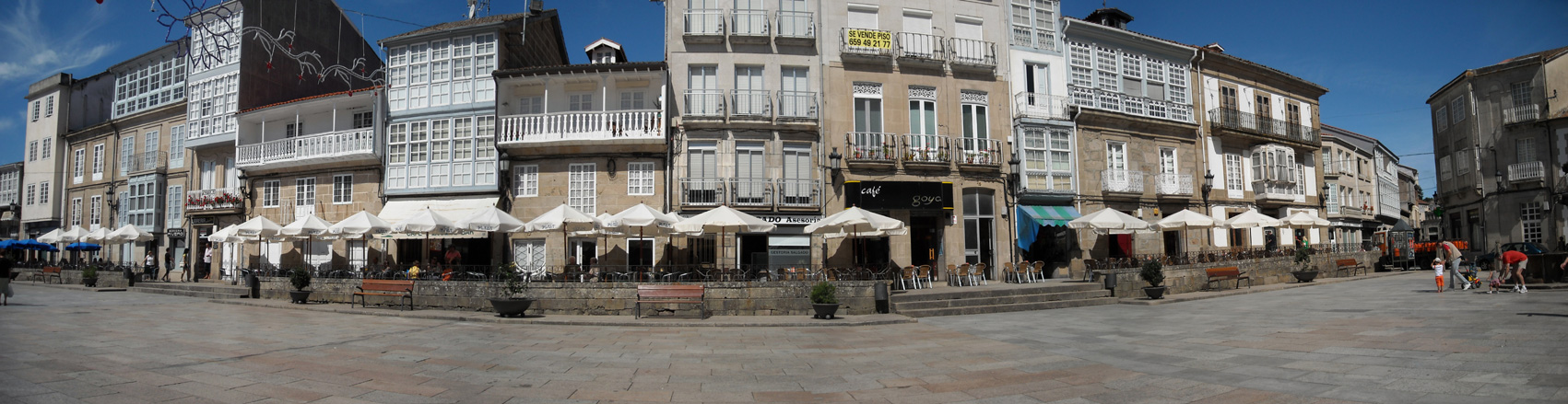 a small fountain in front of some buildings