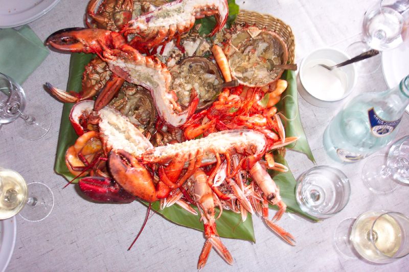 an assortment of assorted cooked seafood on a plate