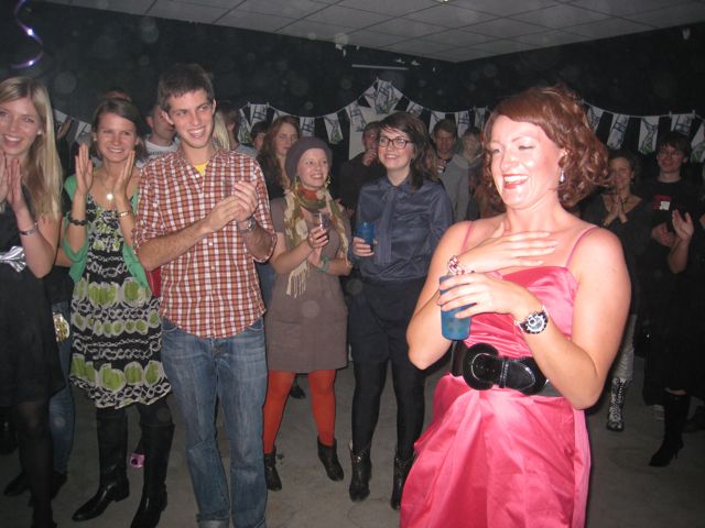 a group of people standing next to each other at a party