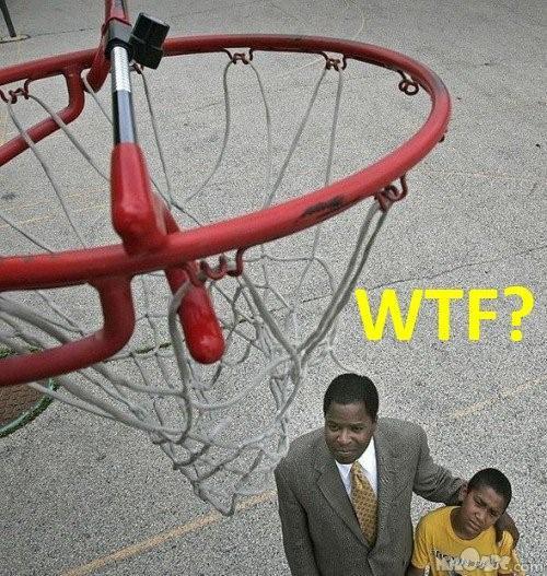 a man and boy standing by a basketball net with the words wtf