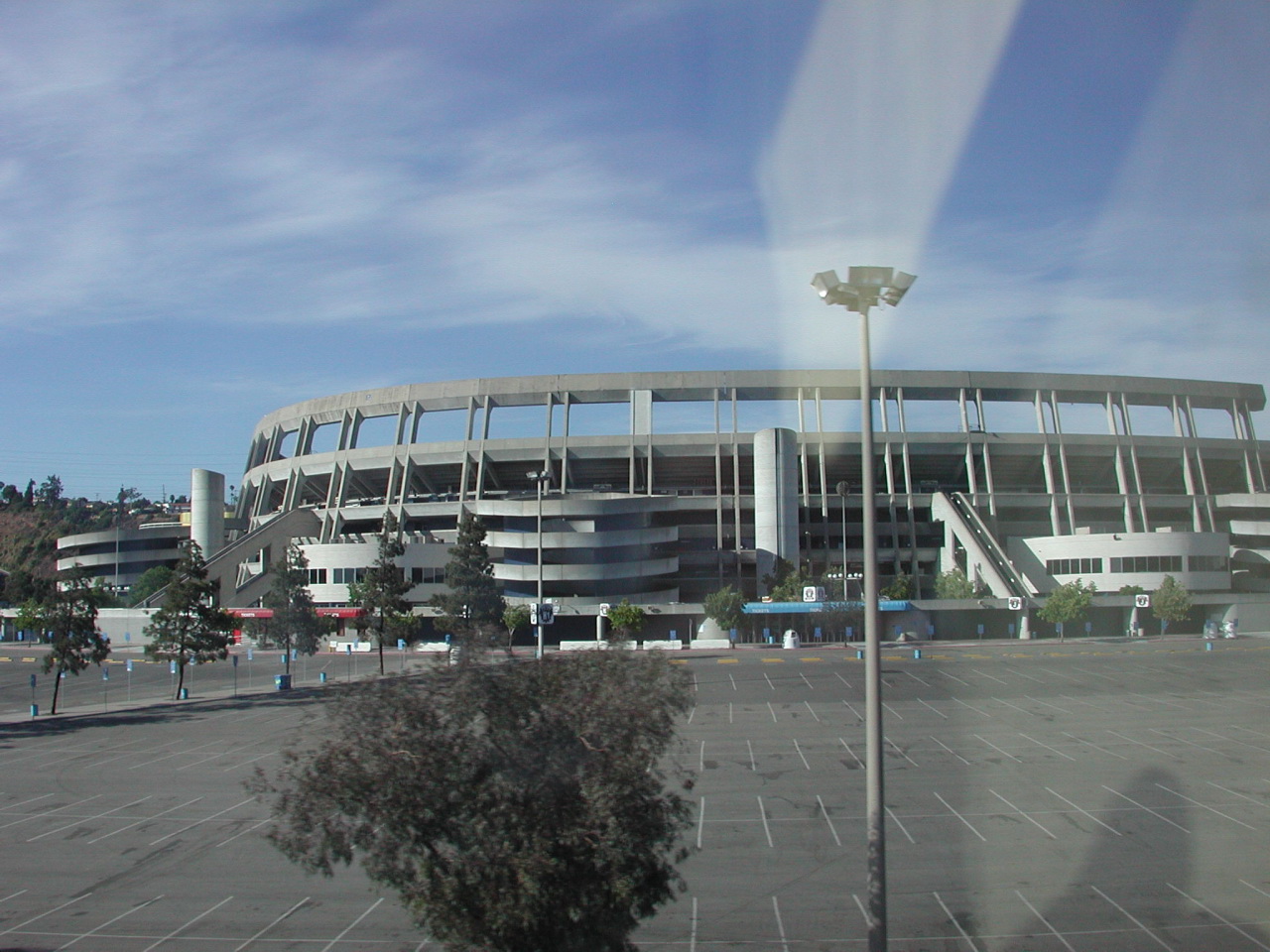 a picture taken through a bus window looking at a building