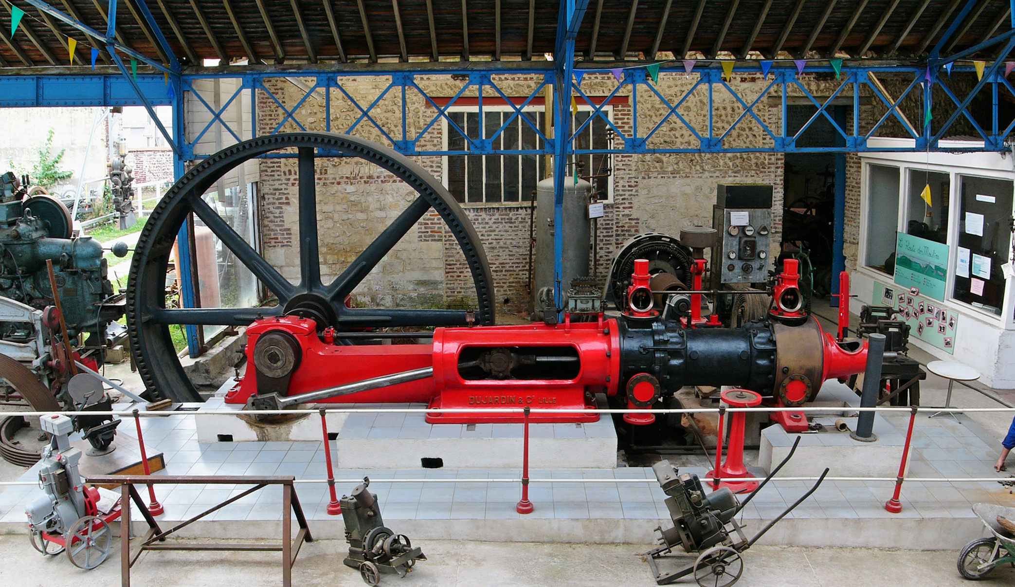 several large machines sit in a display case