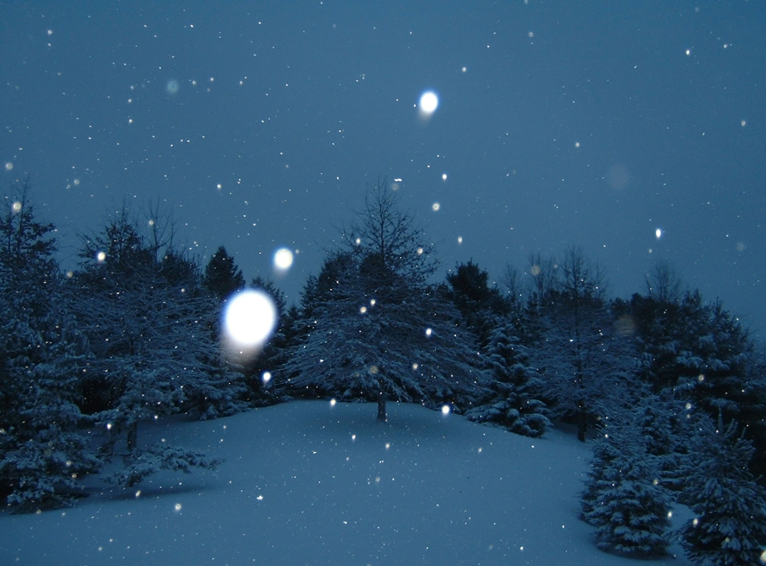 a snowy night with a clear sky and white light