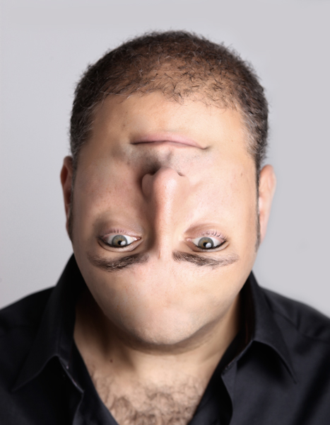an image of man making face with nose in the air
