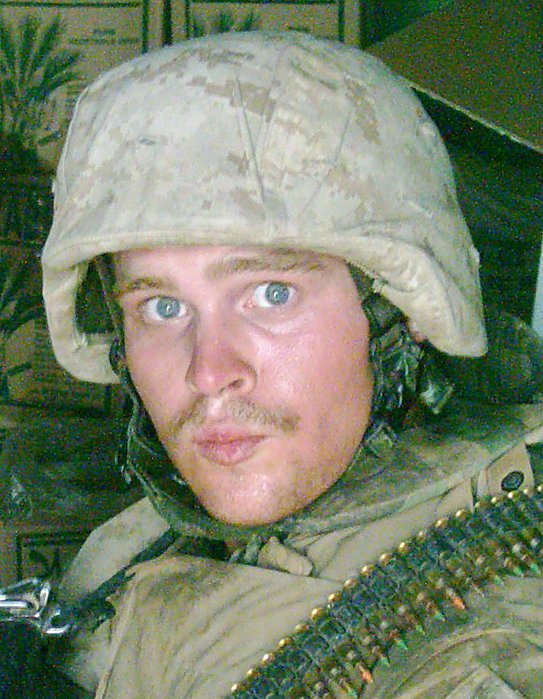 a man in military gear wearing an army helmet