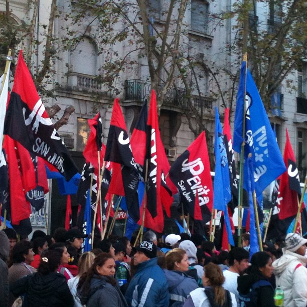 a number of people with flags in the city