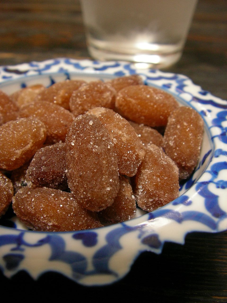 a plate topped with sugar coated donuts