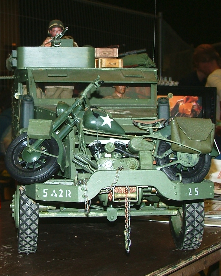 there is a military green armored vehicle on display