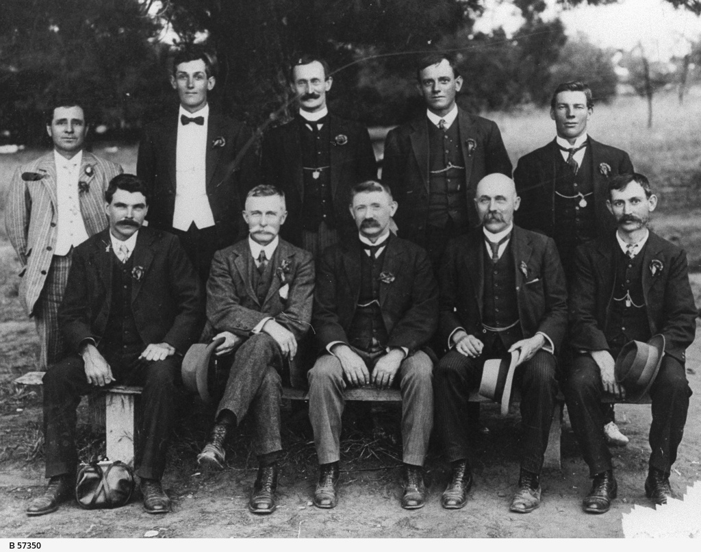 an old po of several men wearing formal wear