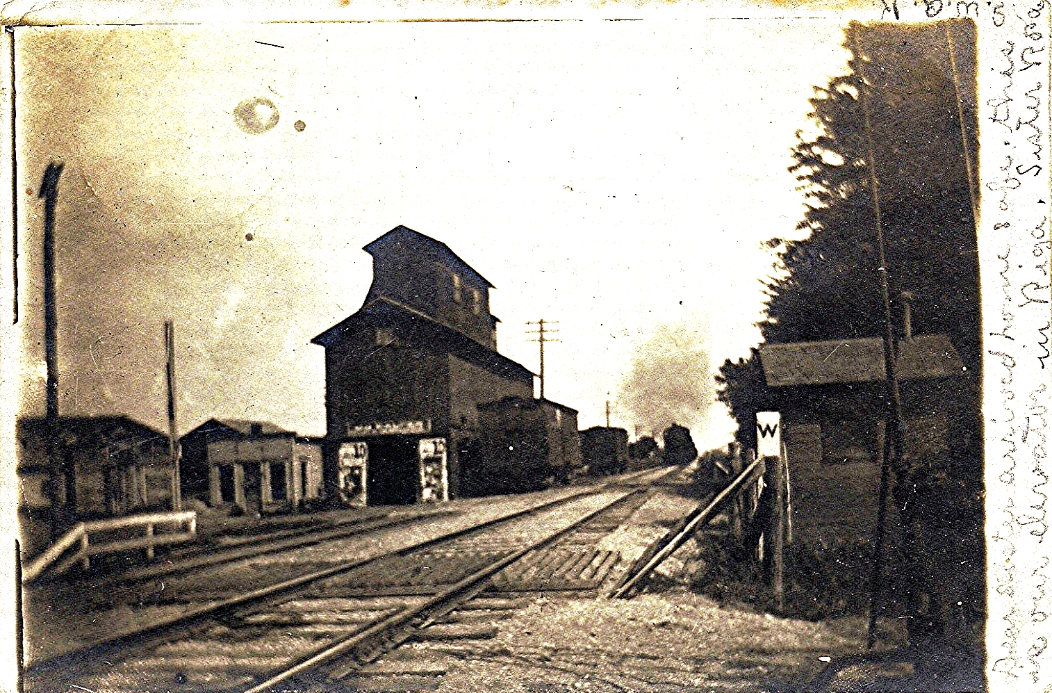 an old black and white po of a train track