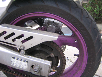 motorcycle rear tire with chain protection on top