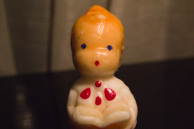 the toy doll has a face and arms