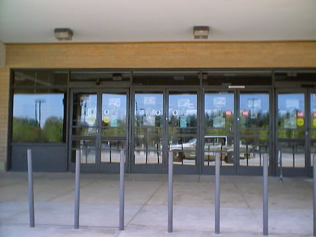 the entrance to a restaurant in front of windows