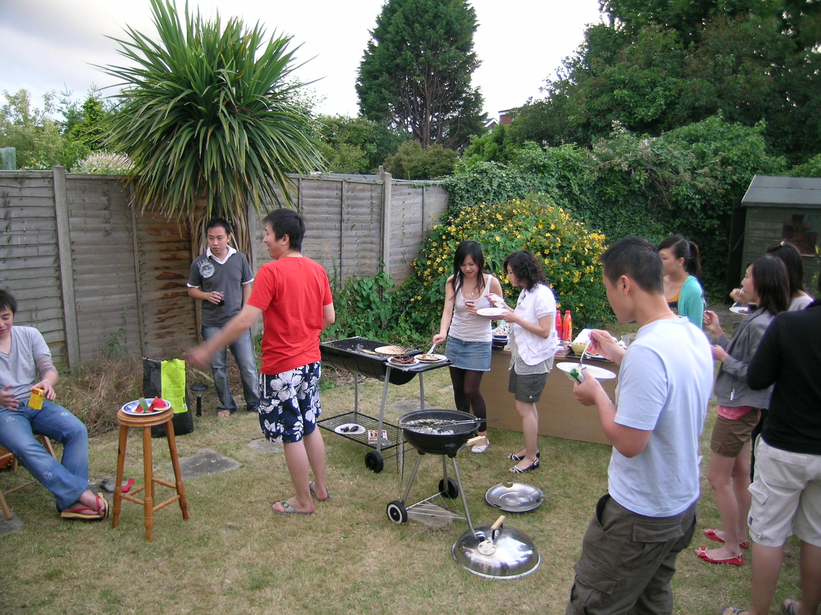 a group of friends eating pizza and playing a game