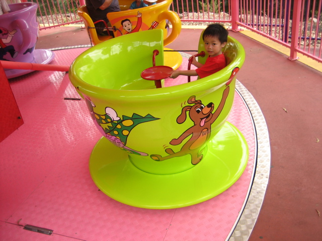 children riding in a toy story ride at the amut park