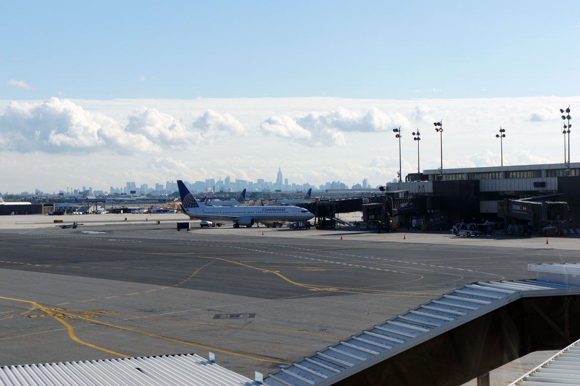 the tarmac with an airplane waiting for passengers to leave