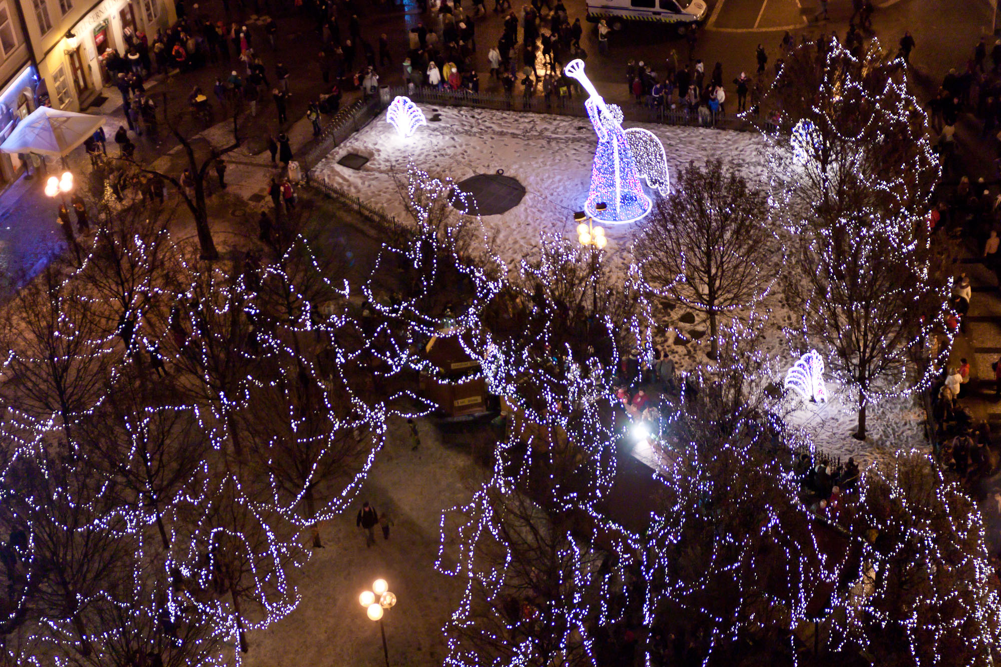 the city at night is lit up with blue lights