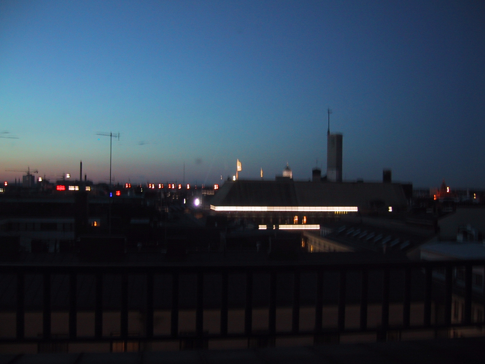 skyline with lots of bright lights and buildings at night