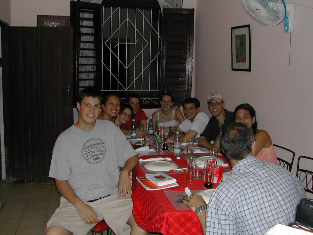 a group of people that are sitting around a table