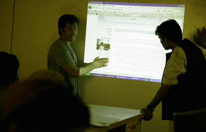a person giving a presentation with the screen showing