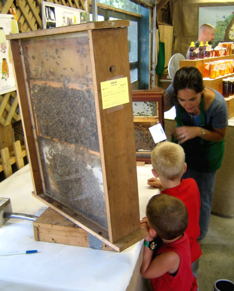 a man and two children in front of a box