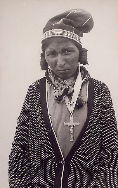 an old po of an old woman wearing a bonnet