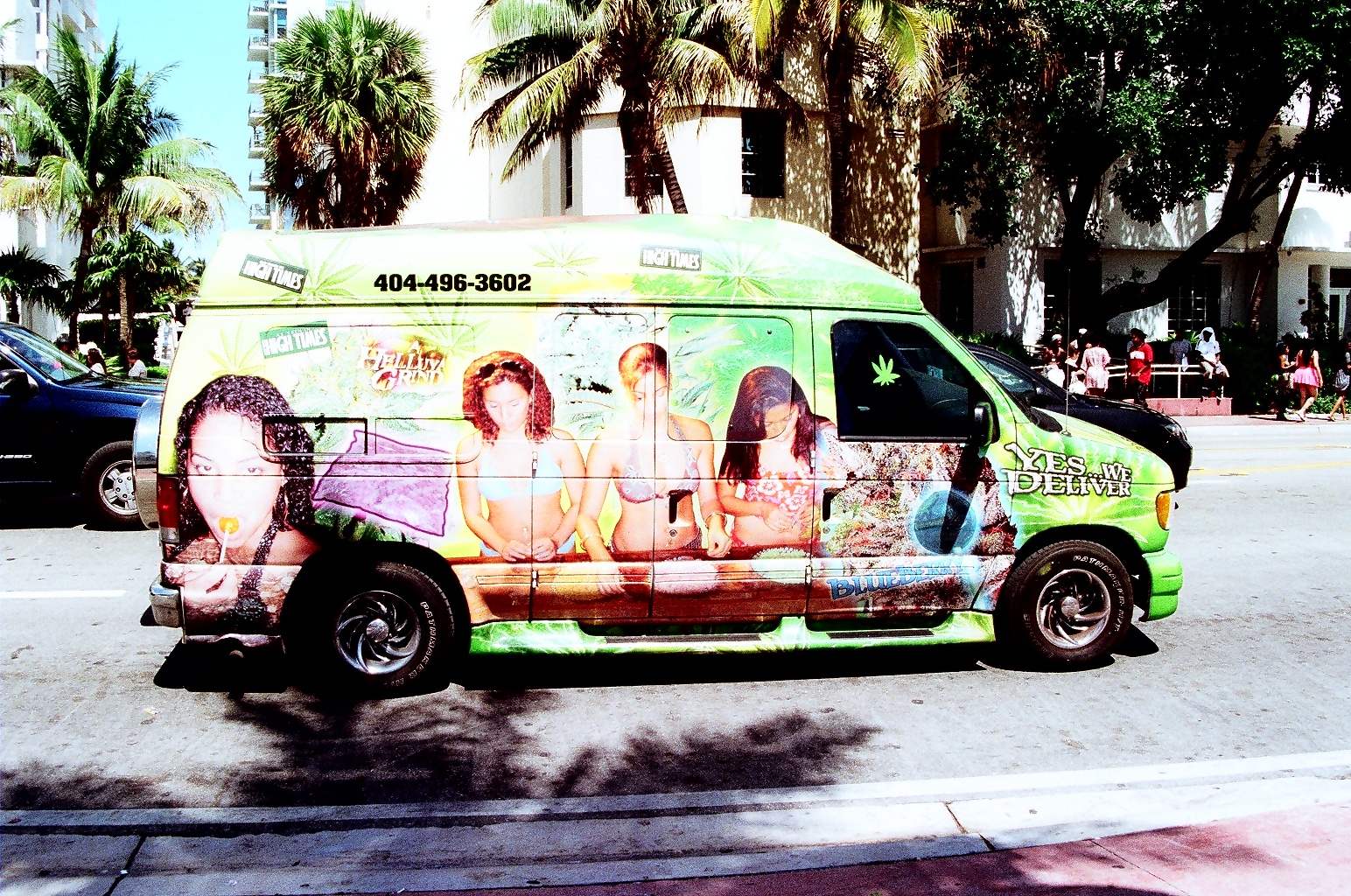 the van is covered with a large mural