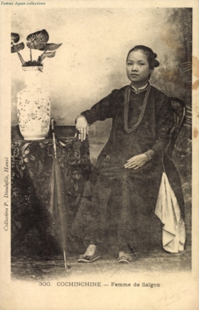 an old po shows an asian woman in a dress