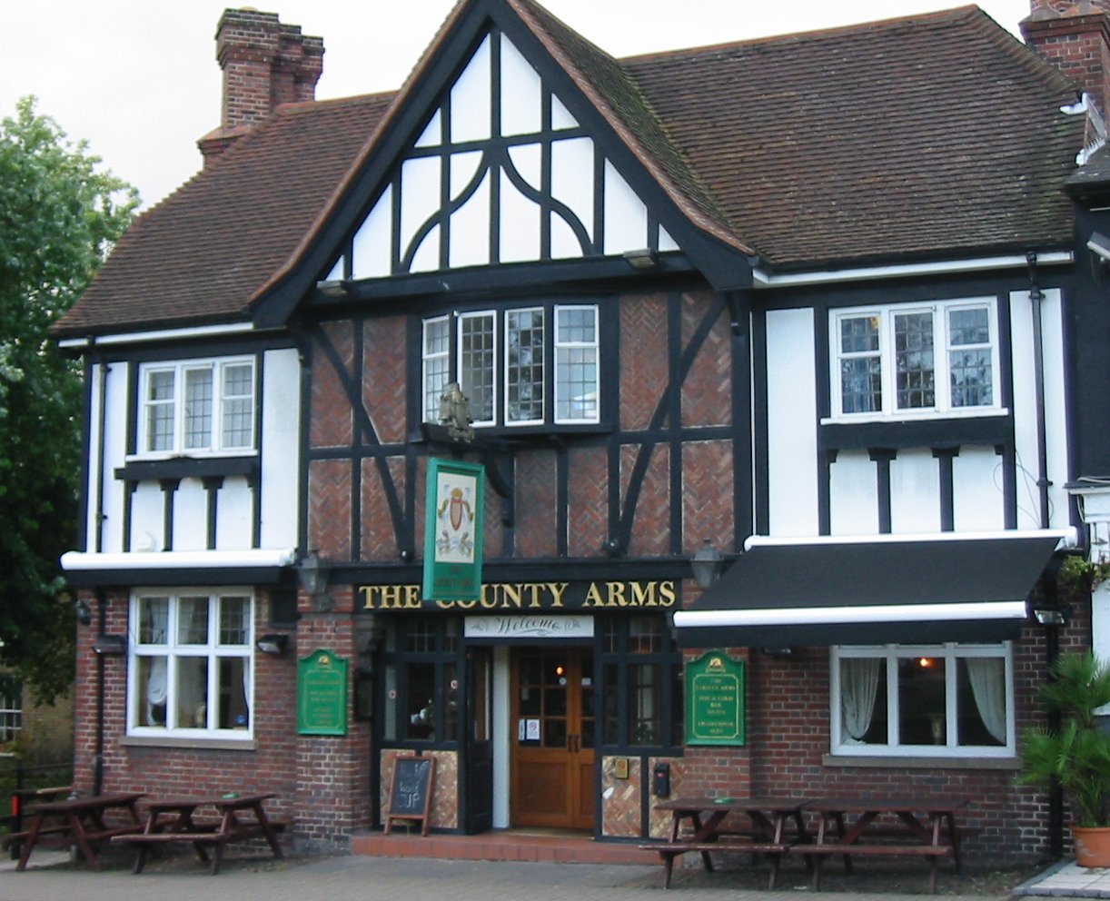 the entrance of the country arms pub in an old style