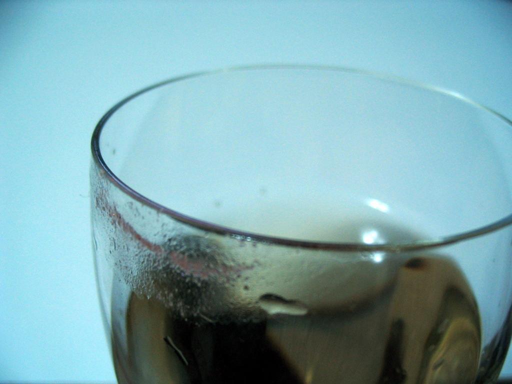 a close up of a glass with liquid