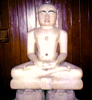 a buddha statue in meditation position on the ground