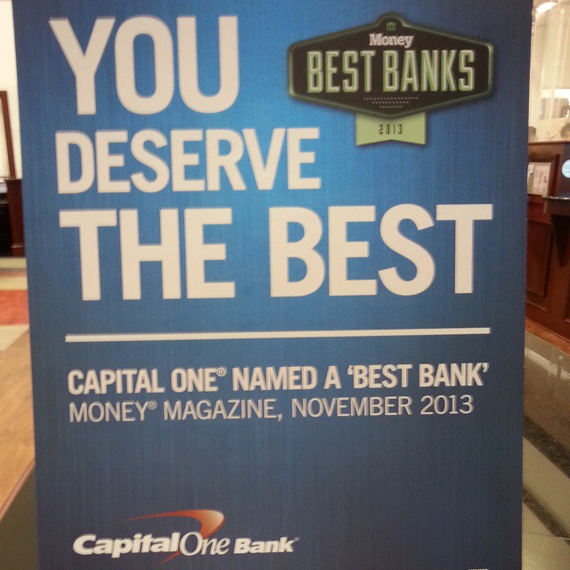a capital one sign advertising a bank account