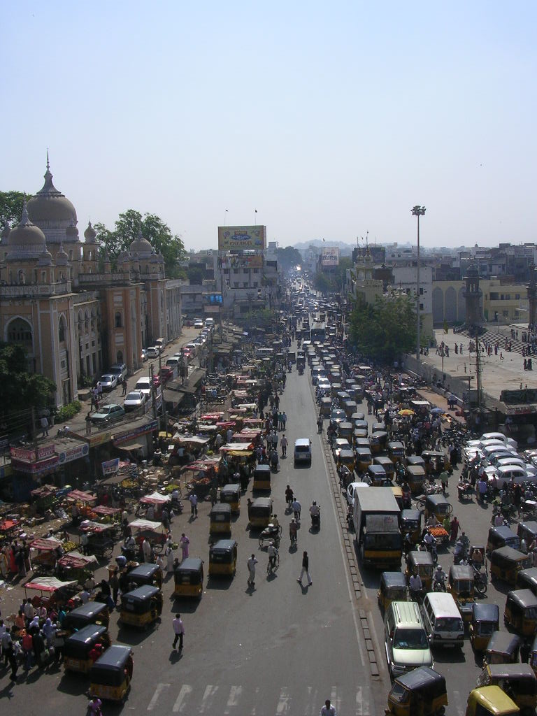 a large group of trucks parked along the road