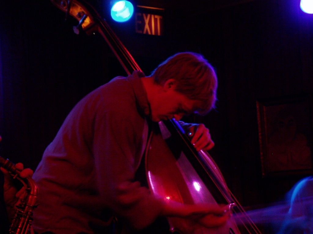 a man playing a musical instrument at night