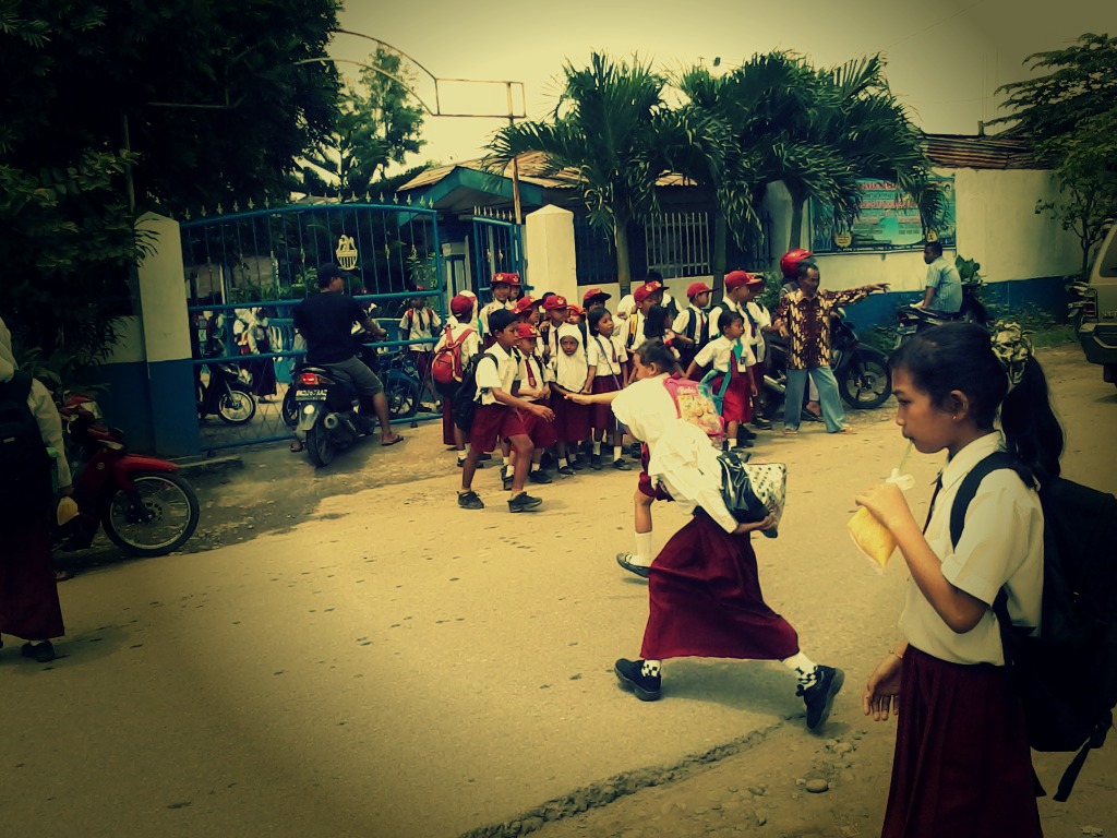 an image of children playing in the street