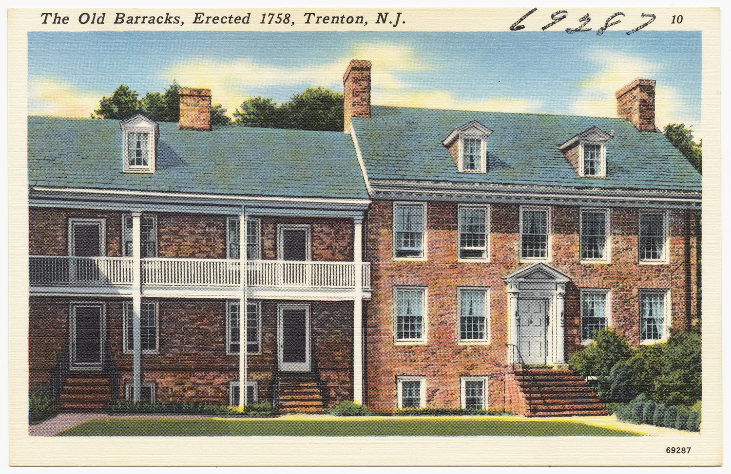a brick house with porch and balconies